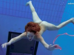 Find-Best-Panties.com presents: Curly hair redhead swims and looks sexy
