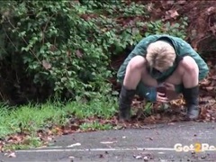 Find-Best-Panties.com presents: Short hair blonde in a parking lot goes pee