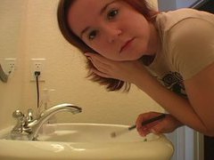 Find-Best-Panties.com presents: Redhead in tee shirt does her makeup
