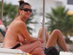 Find-Best-Panties.com presents: Cute milfs tanning topless on a beach vacation