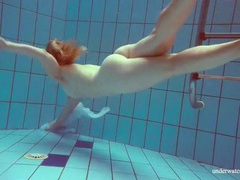 Find-Best-Panties.com presents: Redhead goes for a nude swim in the pool