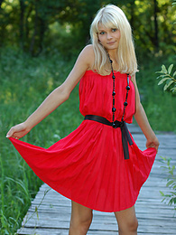 Find-Best-Panties.com presents: Naughty teen appears in her sexy red dress and starts removing it passionately and moving slowly.